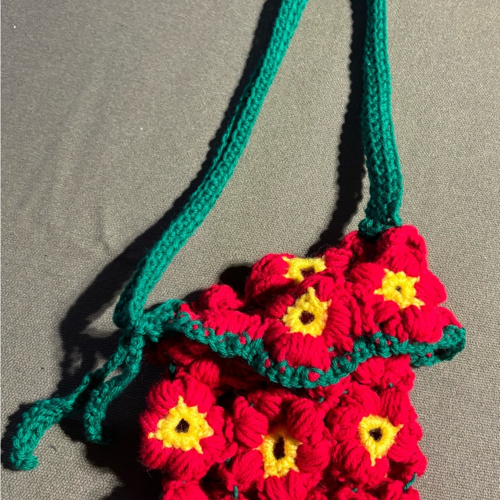 Vibrant Red and Green Crossbody Bag with Floral Design